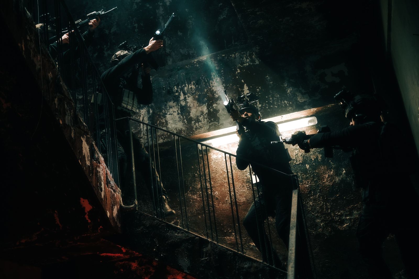 A team moving through a derelict urban training area