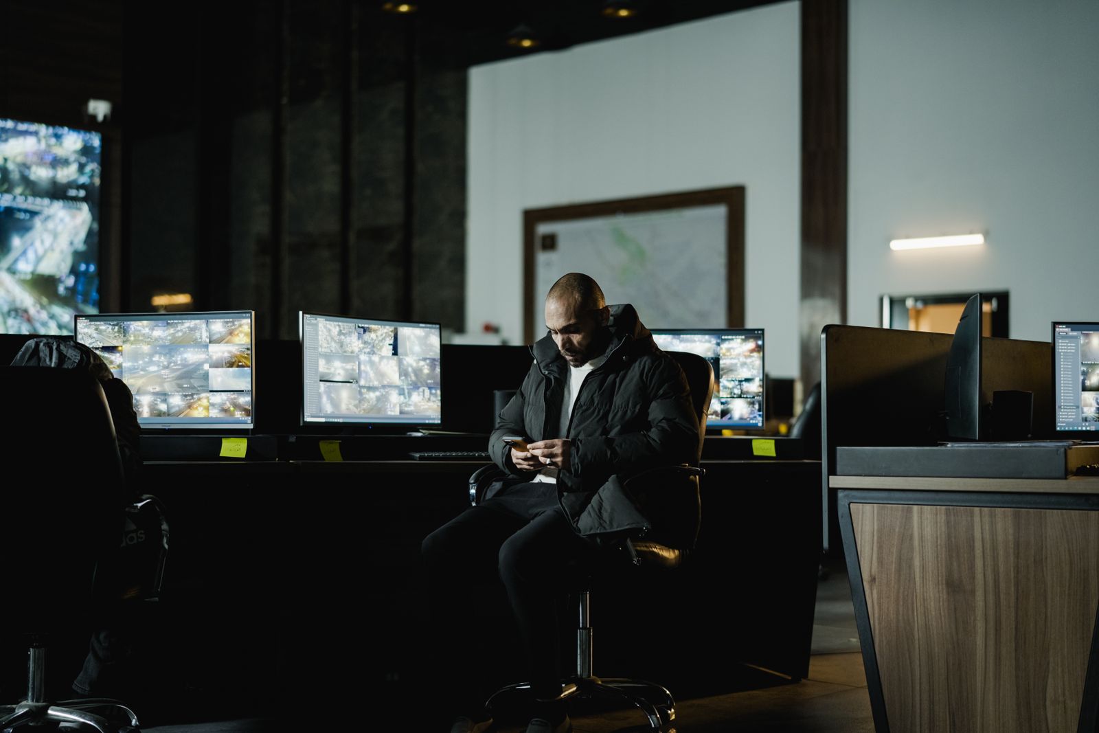 An analyst reviewing operational data on screen during a debrief