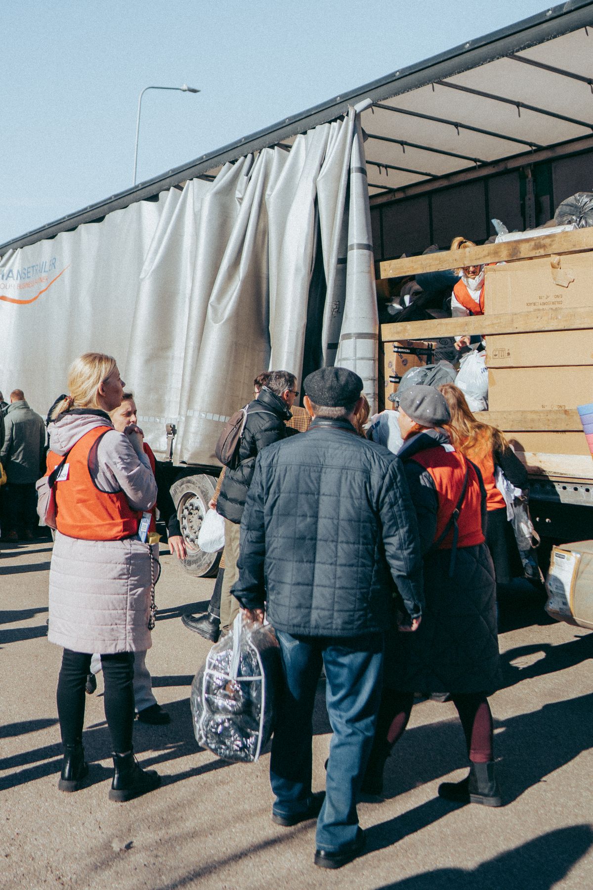 Volunteers unloading relief supplies from a truck