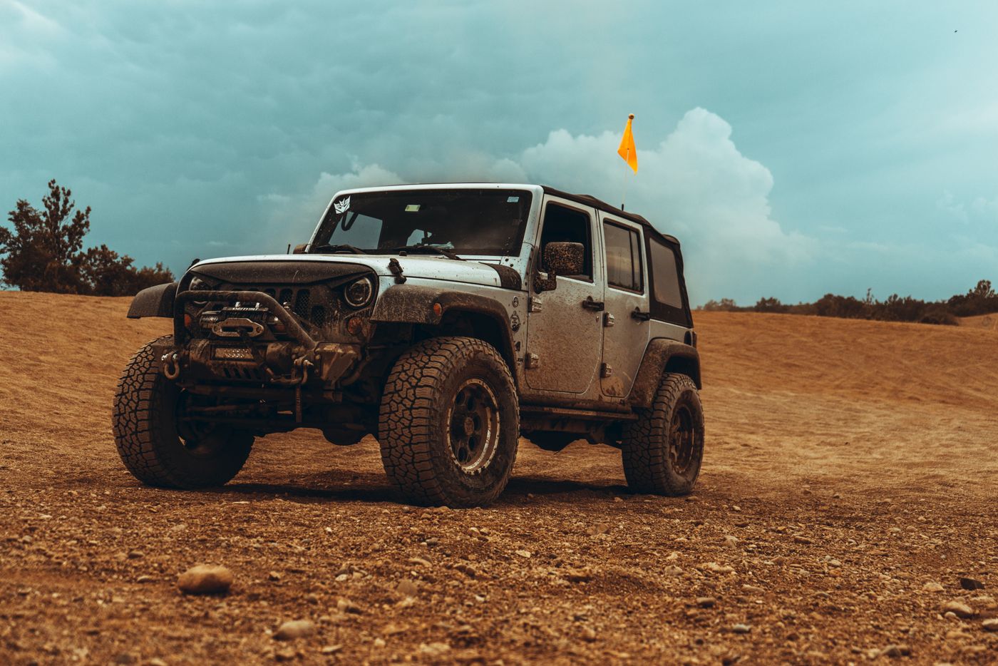 A four-wheel-drive vehicle on a remote dirt track